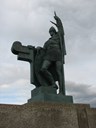 Ingolv Arnarson-minnesmerket i Reykjavik. Det vart laga av Einar Jonsson i 1907, men ikkje reist før i 1924. Minnesmerket i Rivedal er ein kopi av minnesmerket i Reykjavik.
