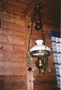 <p>Parafinlampe fr&aring; tida f&oslash;r den eletriske straumen kom. Lampa heng i m&oslash;tesalen som utsmykking og minne om eldre tider.</p>