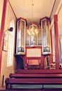 Orgelet stod tidlegare på galleriet, men då kyrkja fekk nytt orgel i 1991 vart det montert framme på nordsida i skipet.