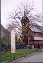 1814-steinen står like ved kyrkja på Tangen. Han er omlag 3 meter høg, prismeforma og kila ut or eit stykke lys granitt i Seimsdalen.