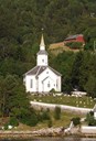 Lavik kyrkje ligg like ved fjorden, eit stykke vest for ferjekaien. Der kyrkja står har det vore kyrkjestad heilt tilbake til 1100-talet.
